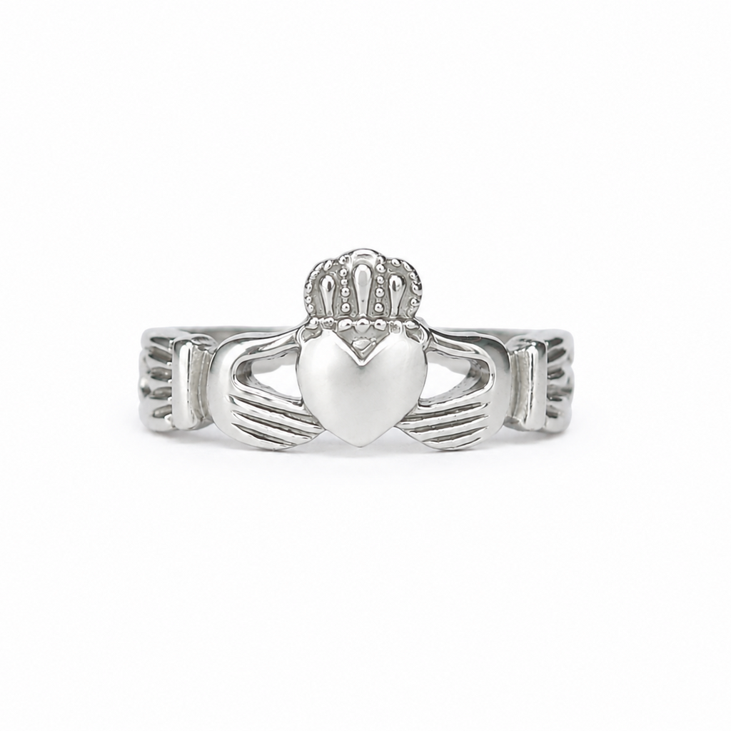 A silver Claddagh ring featuring a heart held by two hands under a crown, shown on a plain white background.
